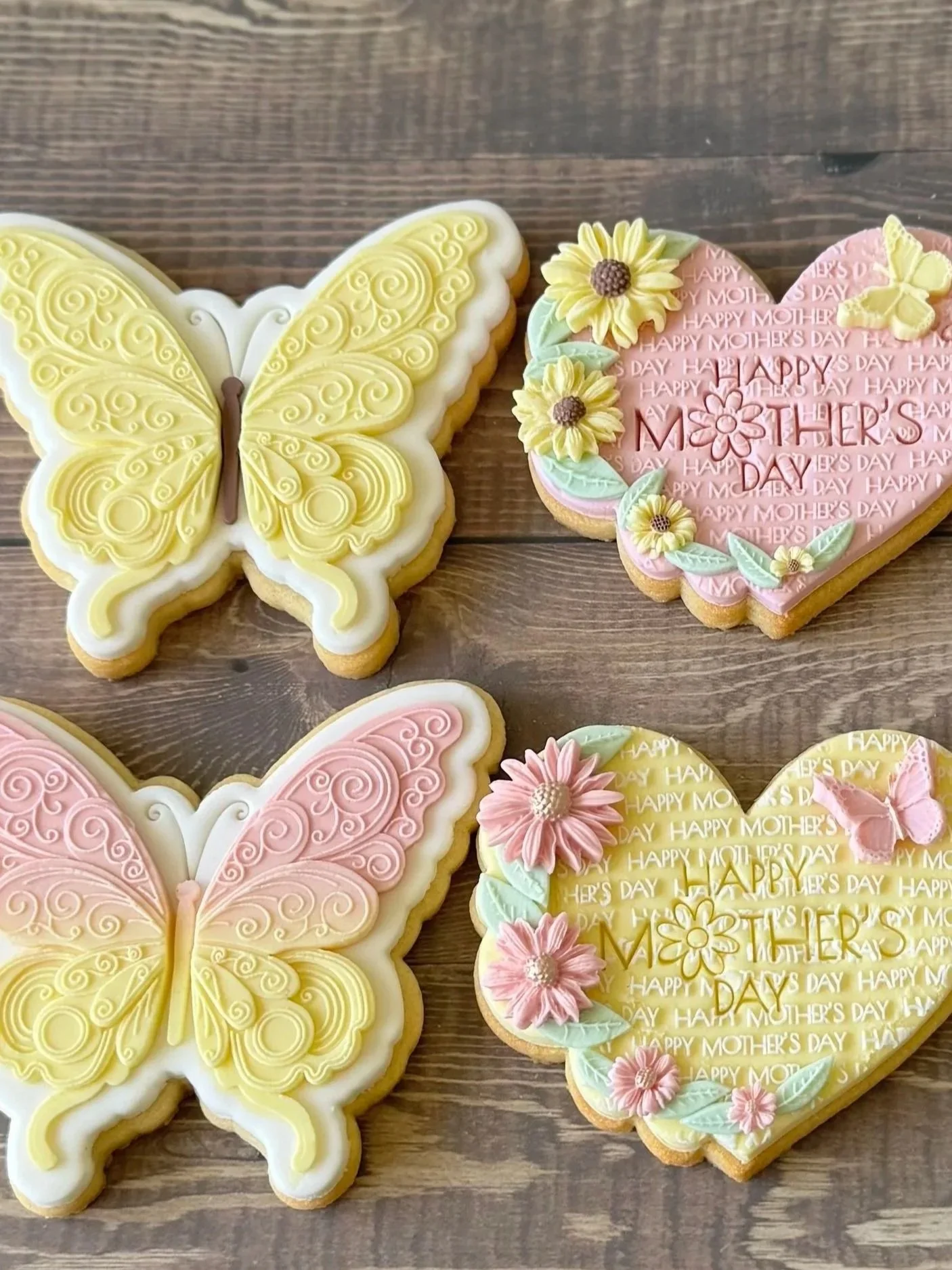 Decorated cookies with flowers, butterflies, and a sunflower of butterflies