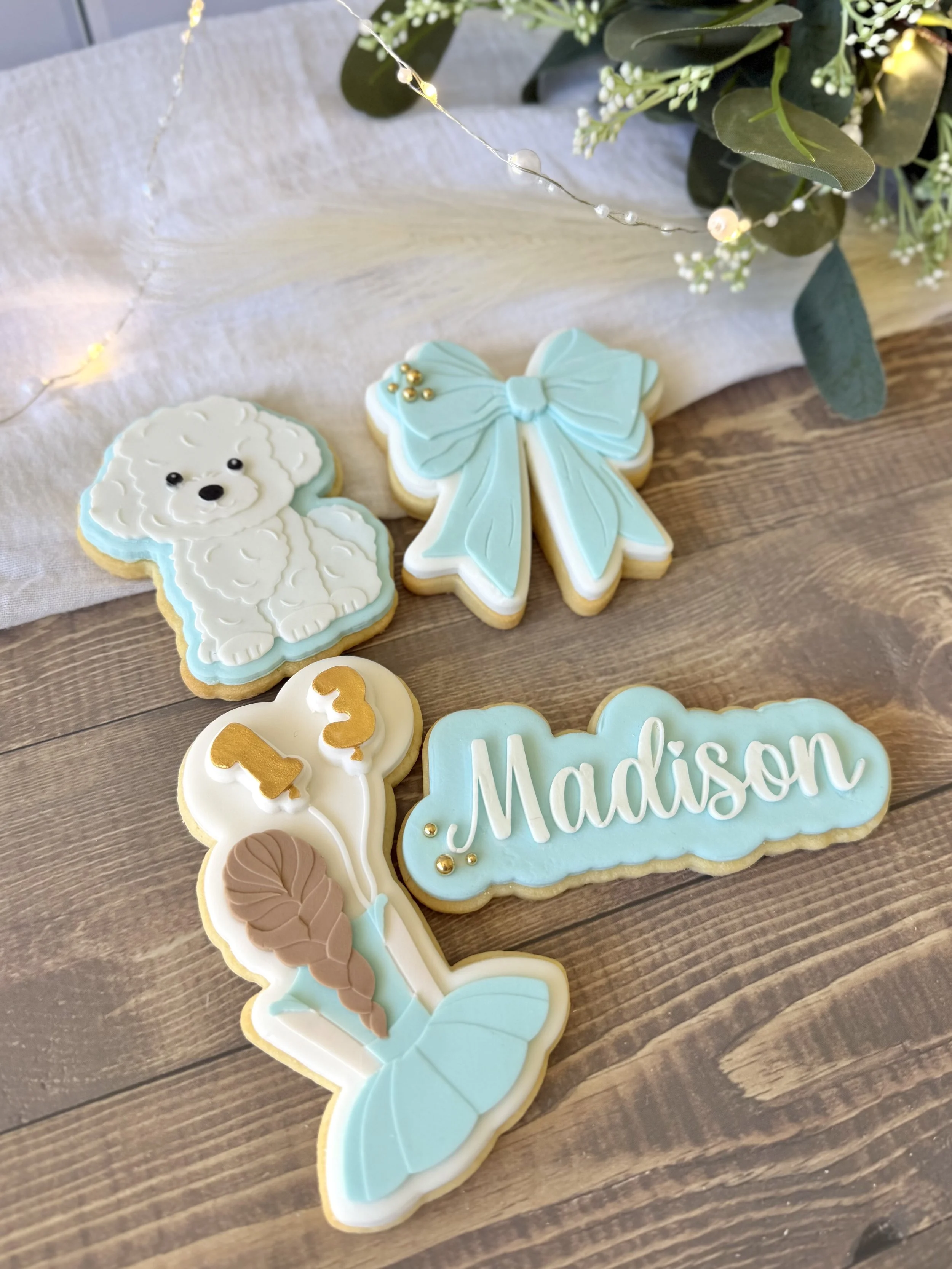 Custom cookies for 13th birthday featuring bow and cute puppy