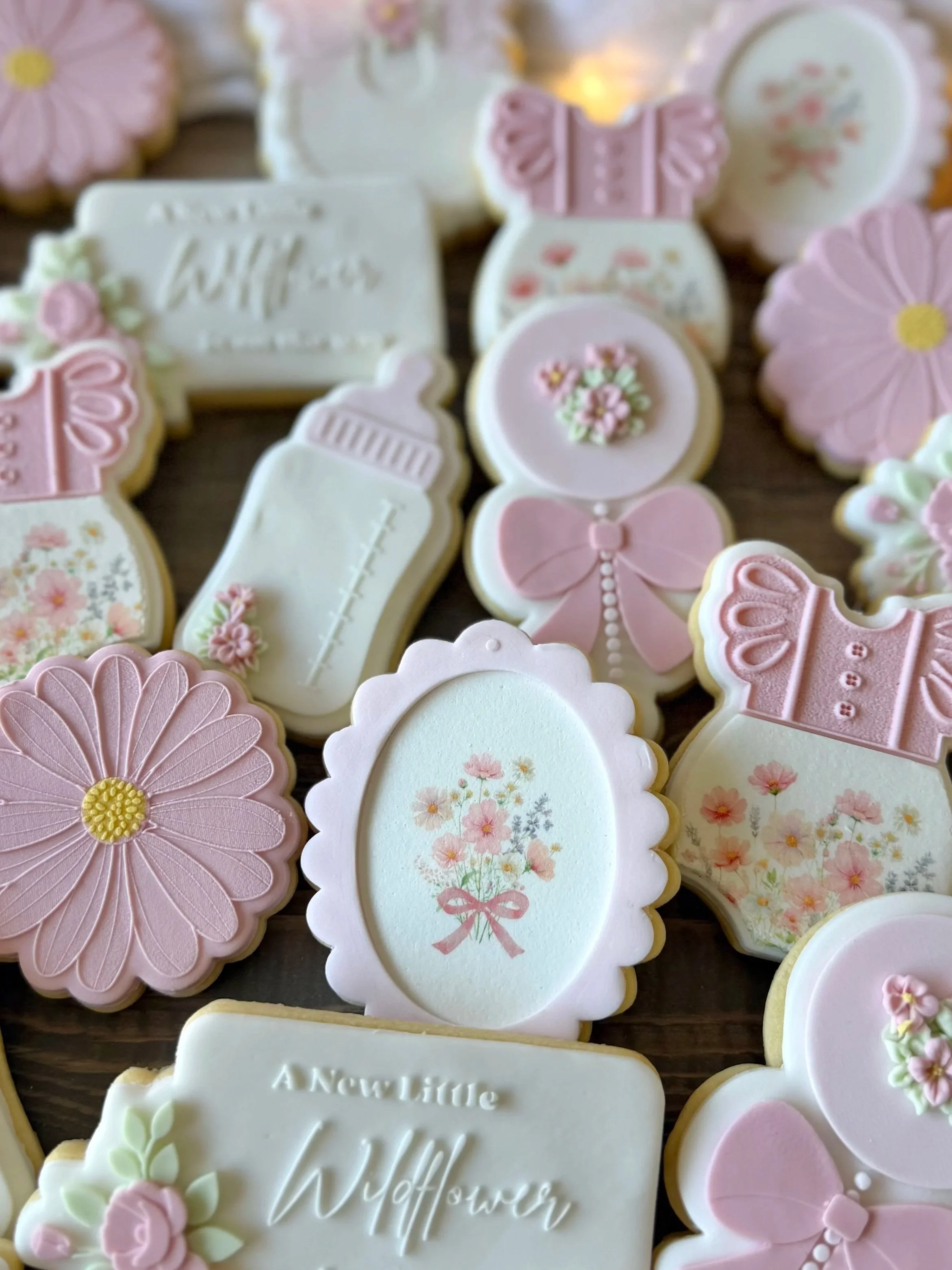 Handcrafted baby-in-bloom-themed fondant cookies for a baby shower