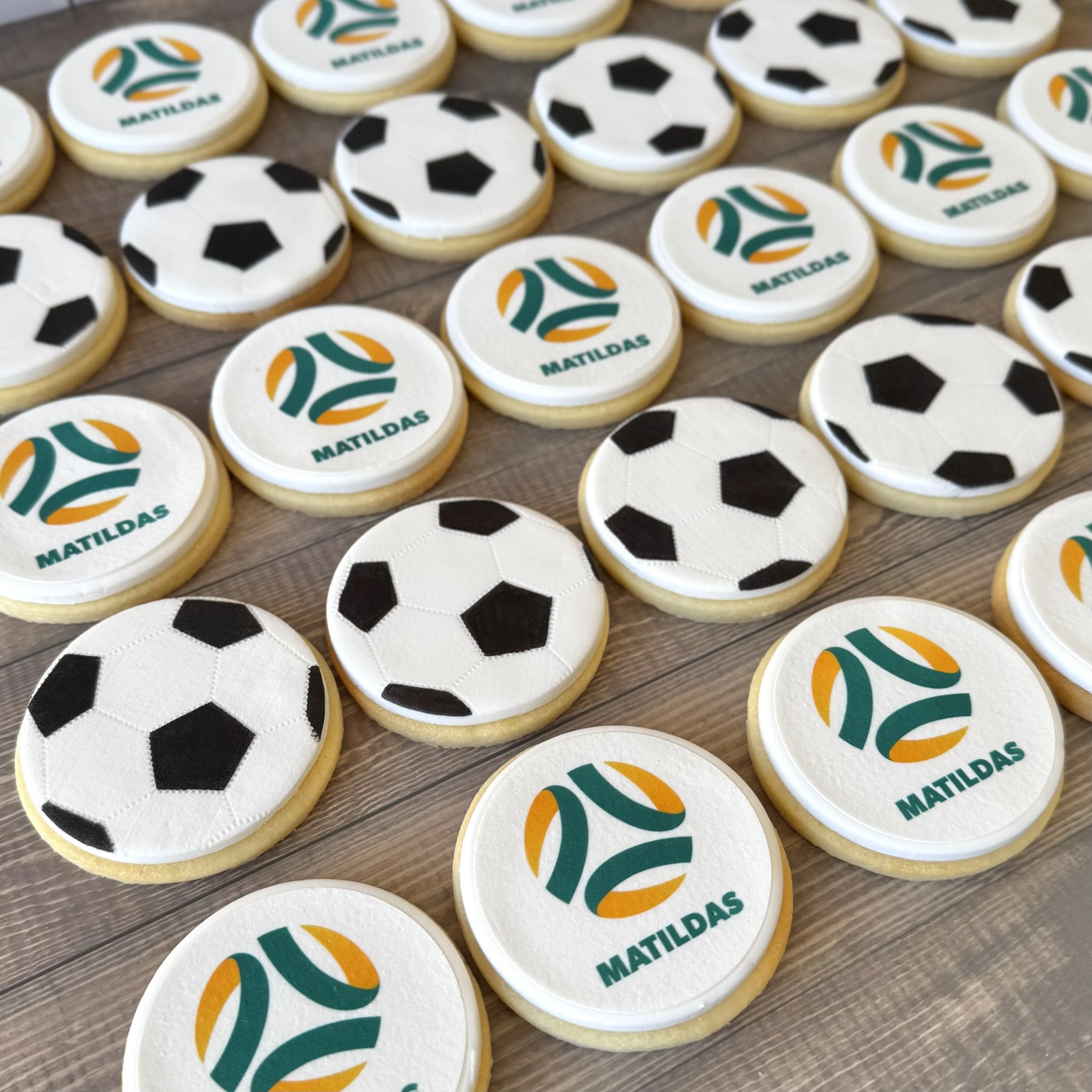 Cookies decorated with soccer ball and Matildas logos