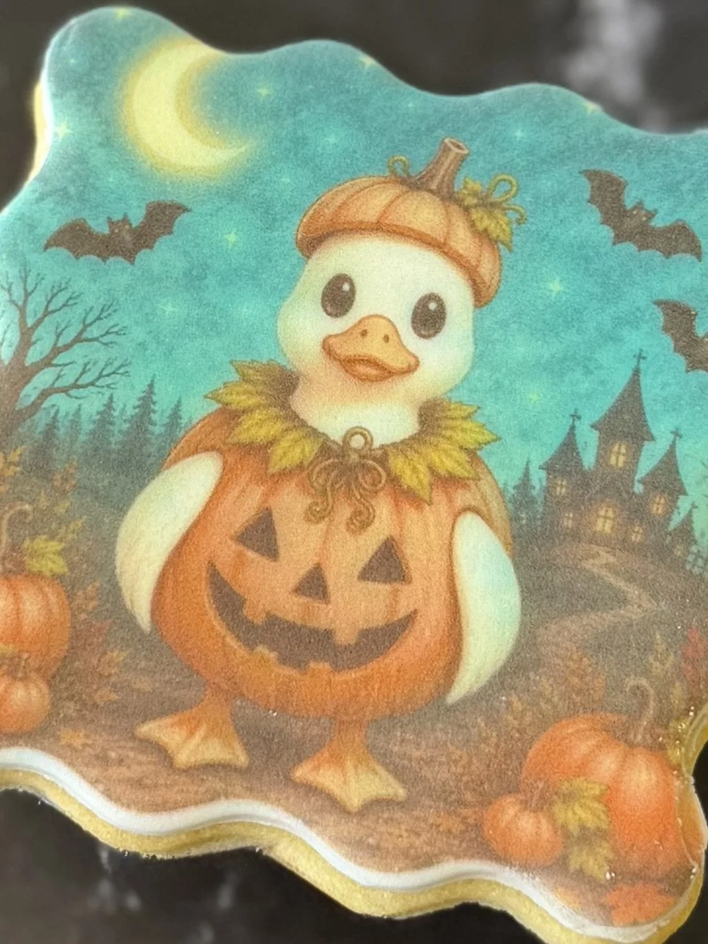 Halloween-themed Silly Goose sugar cookies featuring a goose dressed as a pumpkin, with detailed edible printed artwork