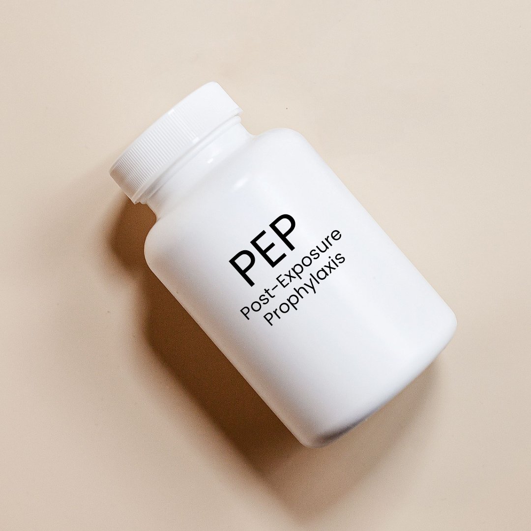 White pill bottle labeled 'PEP Post-Exposure Prophylaxis' on a beige background.