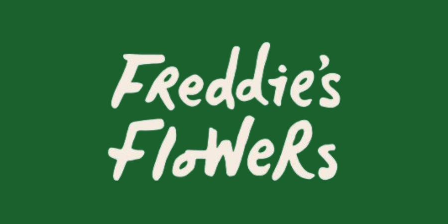 Green background with white handwritten text saying 'Freddie's Flowers'.