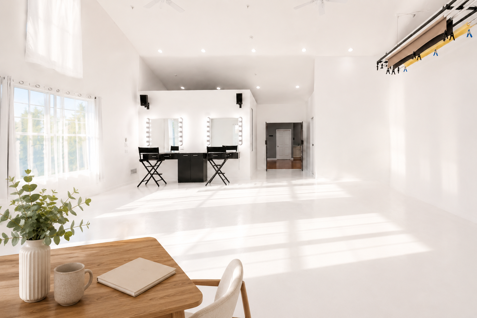 Natural light creative studio with workspace and makeup stations at Hopewell Creative Space