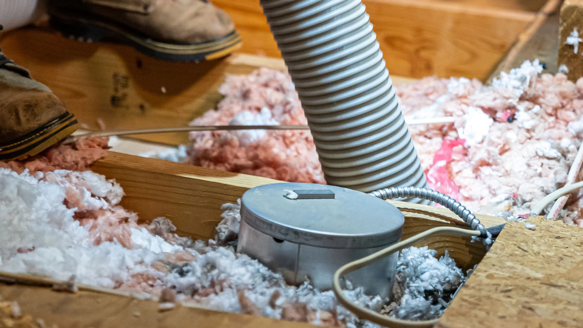 Old insulation removal from home attic.