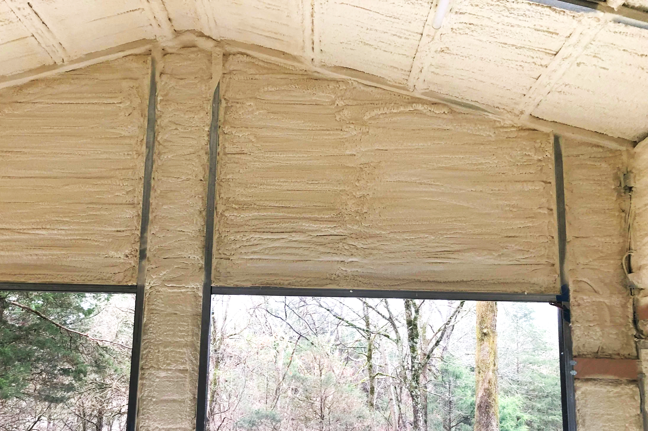 Interior of a metal building with spray foam insulation.