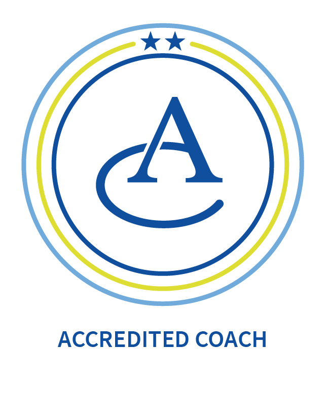 A circular logo with a large letter 'A' and a stylized swoosh underneath, surrounded by two concentric circles with stars at the top; the words 'ACCREDITED COACH' are below the emblem.