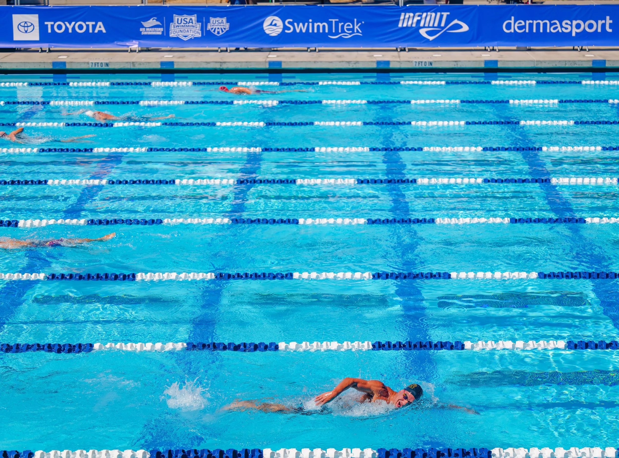Swimmers racing in the outdoor pool at the 2026 USMS Summer Nationals in Sacramento.