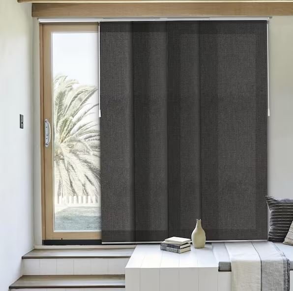 A large sliding door with modern sliding panels slides and stacks effortlessly to create a perfect view . Georgetown , Guyana.