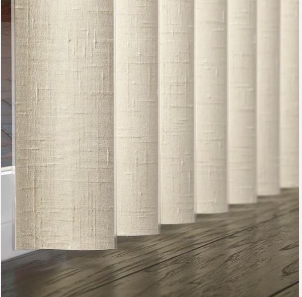 Professionally measured and installed S-Shaped vertical blinds with beige color that perfectly contrasts with the wooden floors in Georgetown , Guyana