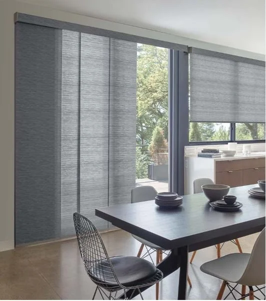 Modern sliding panels that are coordinated the the same fabric on roller shade with a valance in Georgetown,Guyana