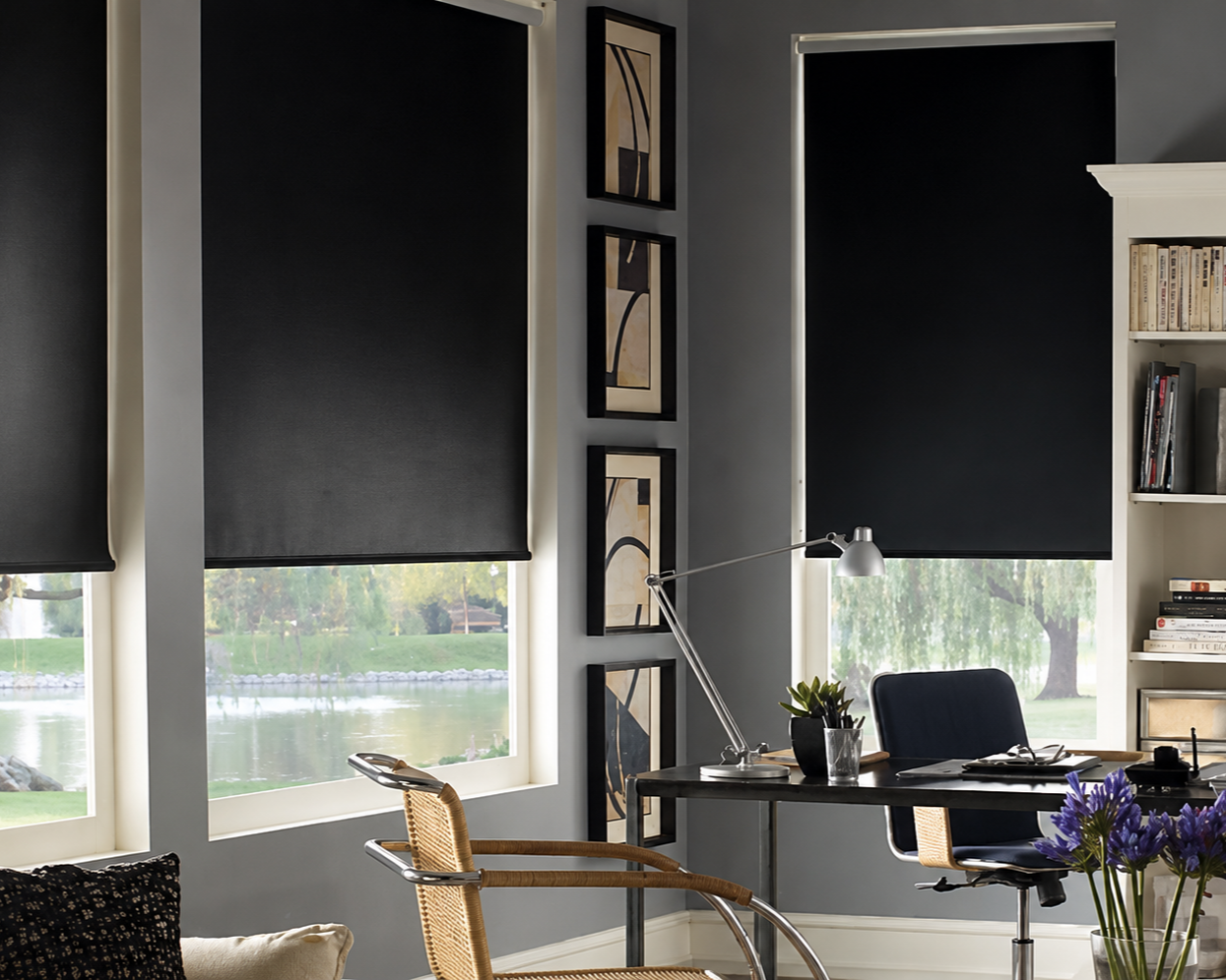 Cordless Blackout roller shades in an office that are slightly raised to let in the perfect amount of light ,professionally measured and installed in Georgetown , Guyana.