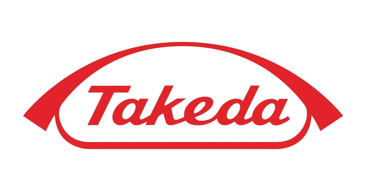 Takeda logo in red and white with a curved line above and below the text.