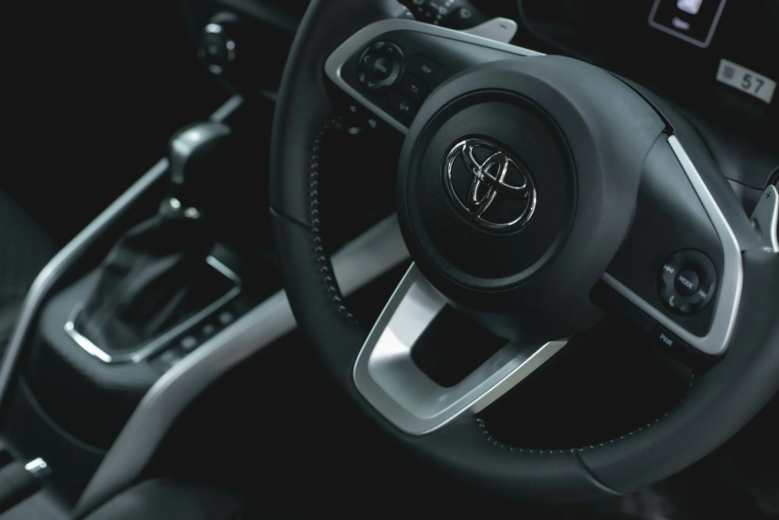 Close-up of a Toyota GC Car Hire team providing private hire vehicle rental services.