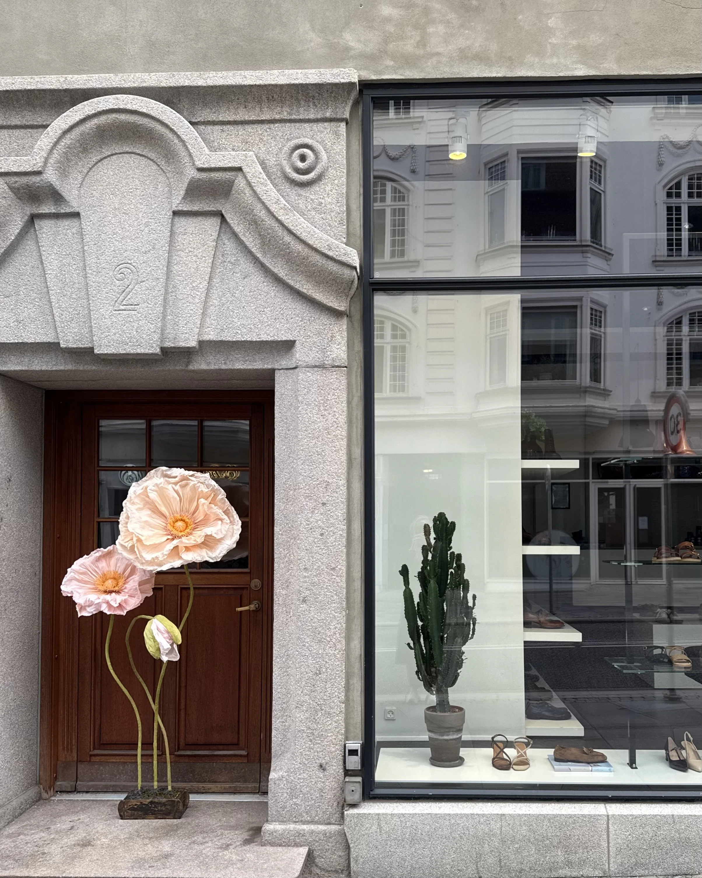 Shop window featuring bespoke giant paper flower installation..