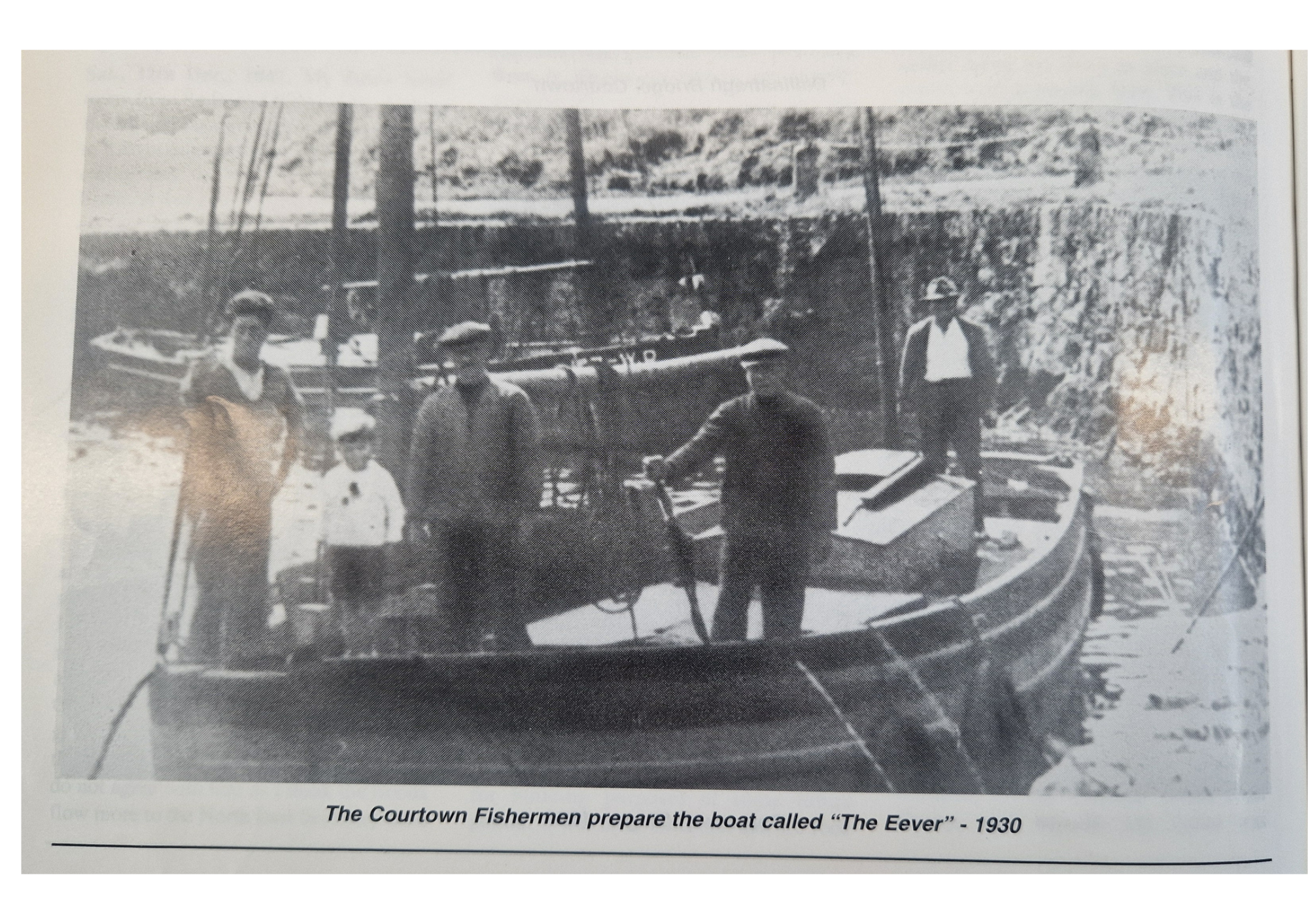 Black and white photo of four men preparing a boat called "The Eever" in 1930, with a mountain and trees in the background.