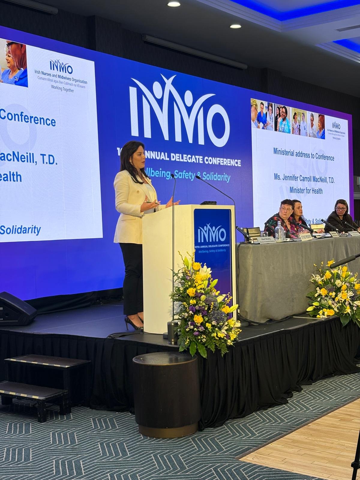 Minister Jennifer Carroll MacNeill TD giving a speech at the INMO 107th Annual Delegate Conference.