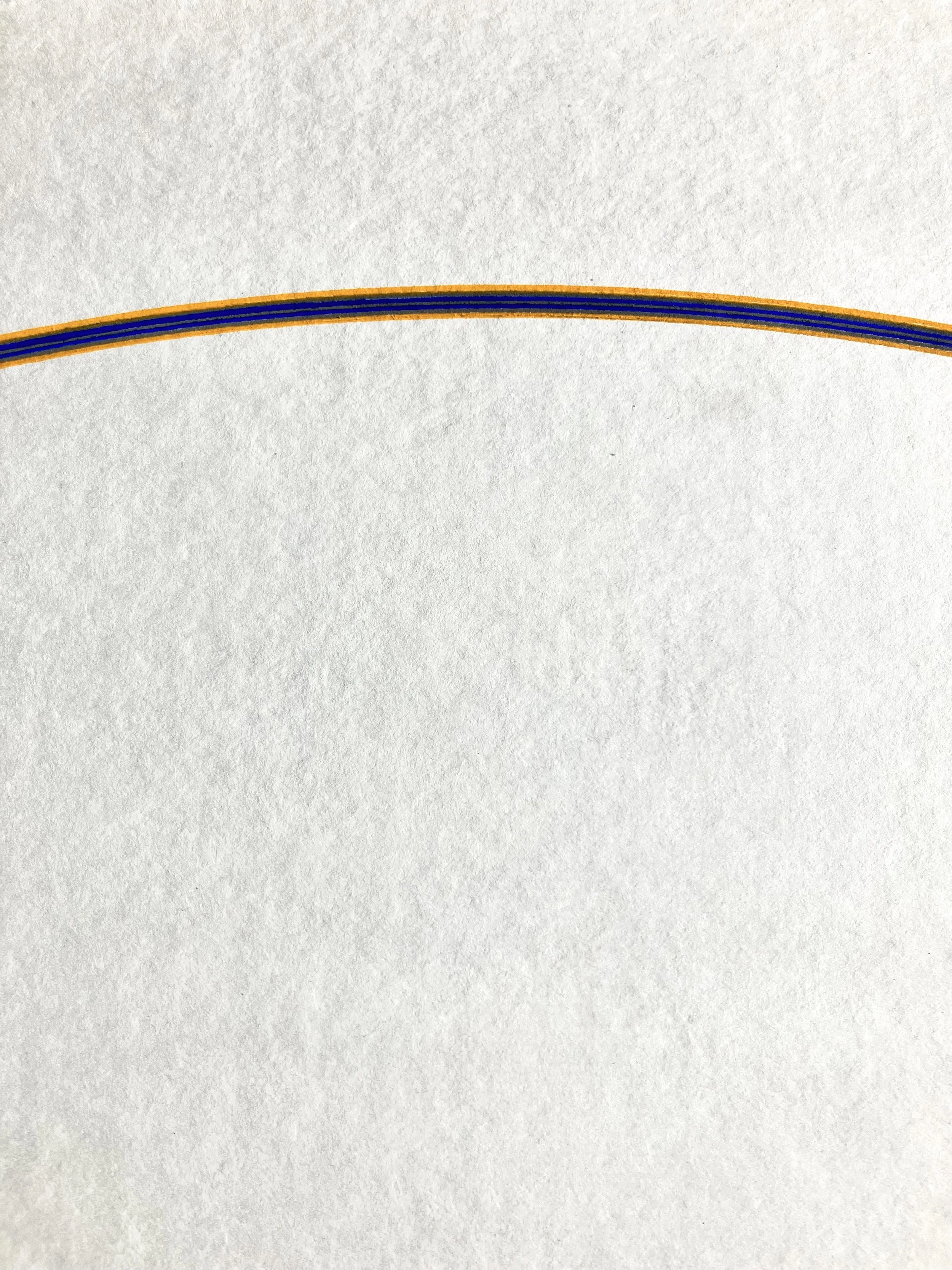 Close-up of a multicolored "DC arc" with blue, black, and orange layers on white handmade paper.