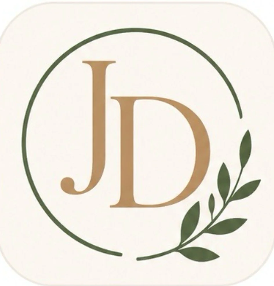 A logo with the initials 'J' and 'D' in gold, surrounded by a green circular line and a green leafy branch on the right side.