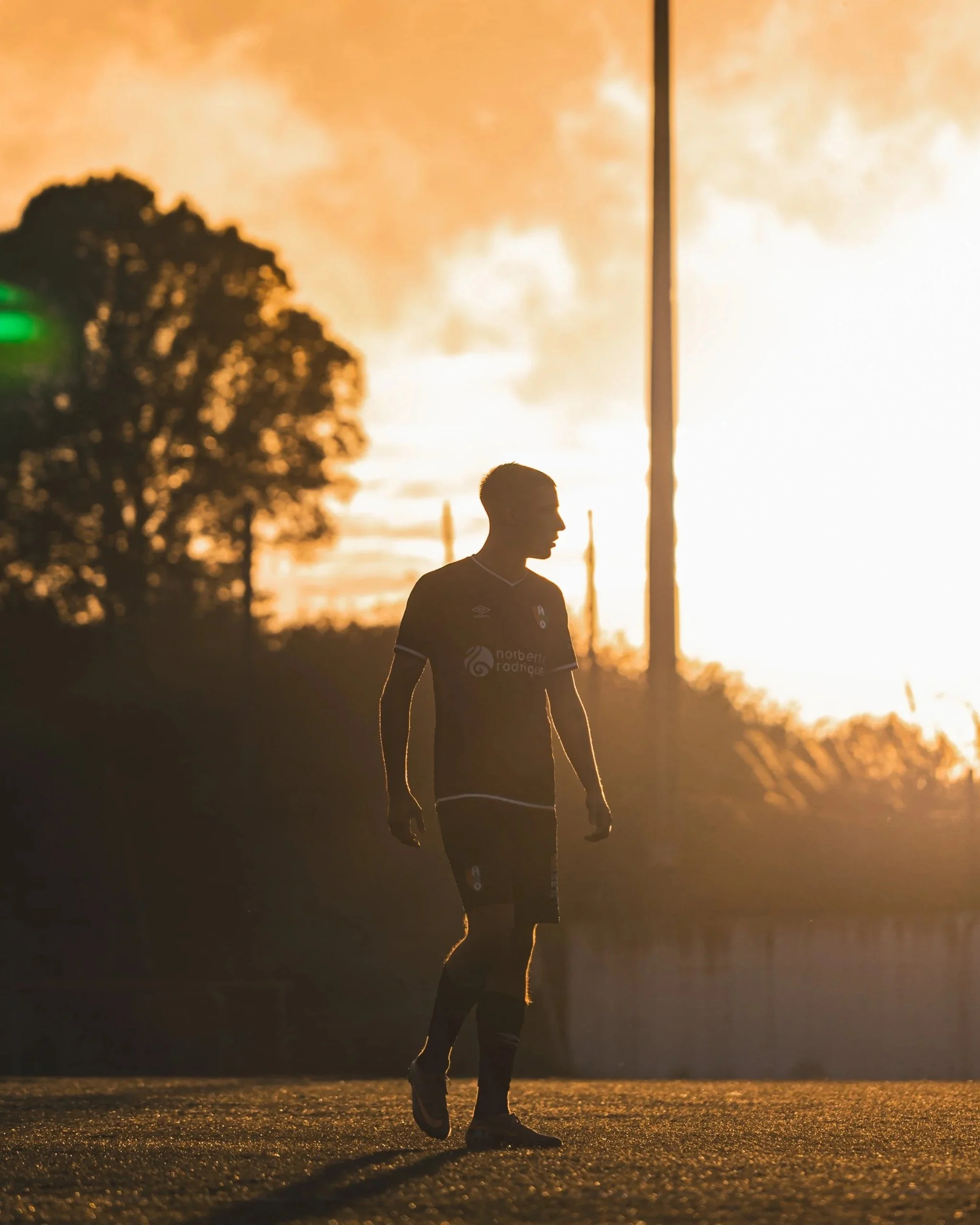 A football player during sunset