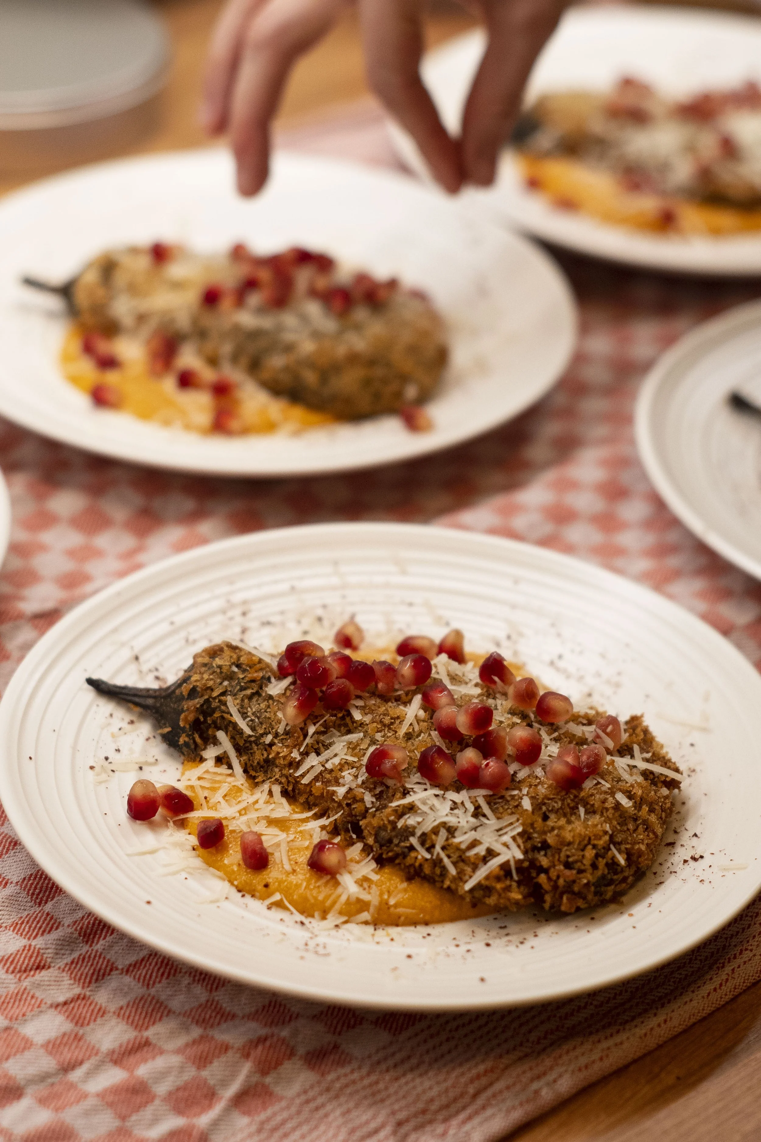 Crispy aubergine dish with pomegranate prepared by private chef Pauline Didier in Berlin