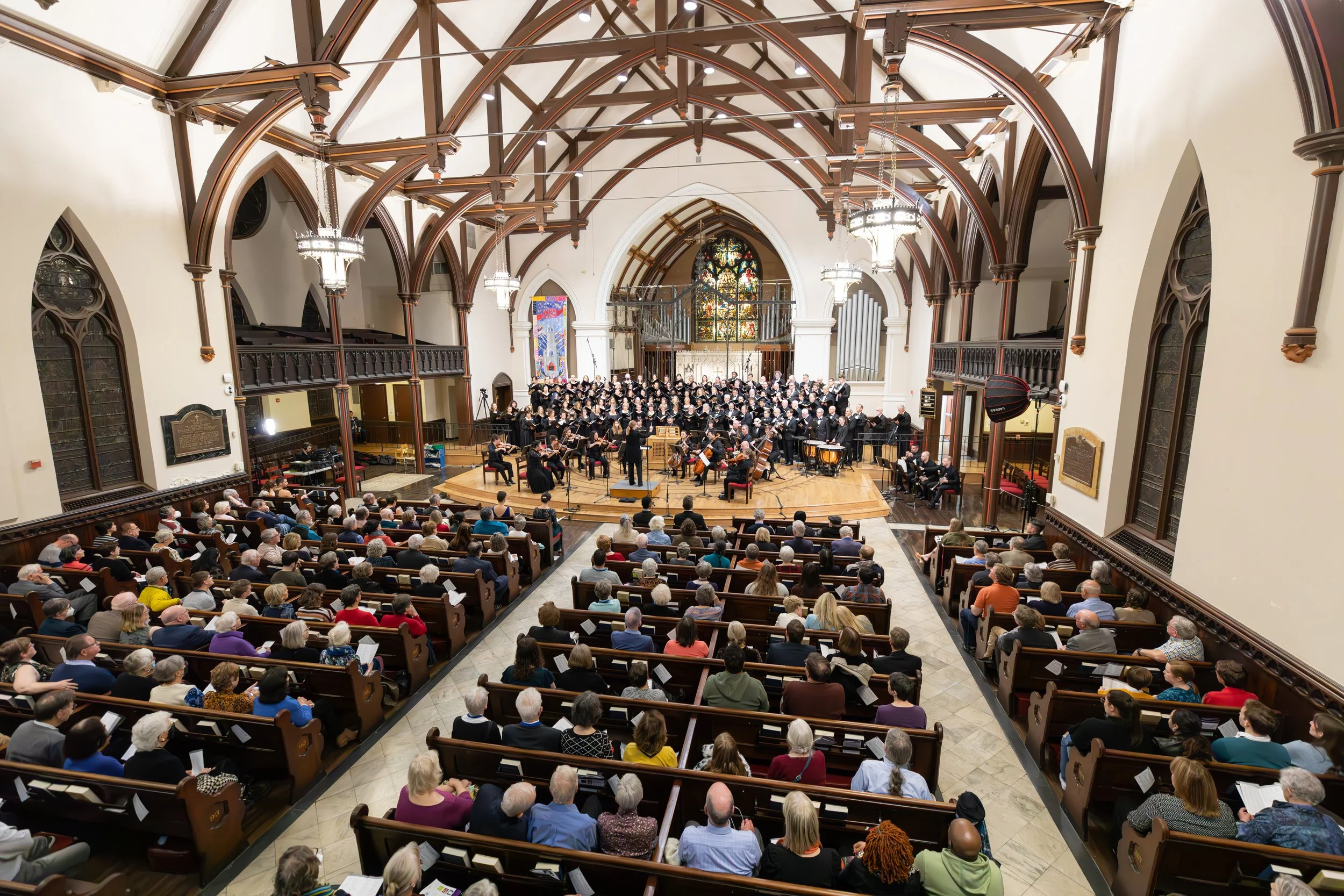 Wide view of the City Choir and orchestra performing at the Church of the Epiphany.