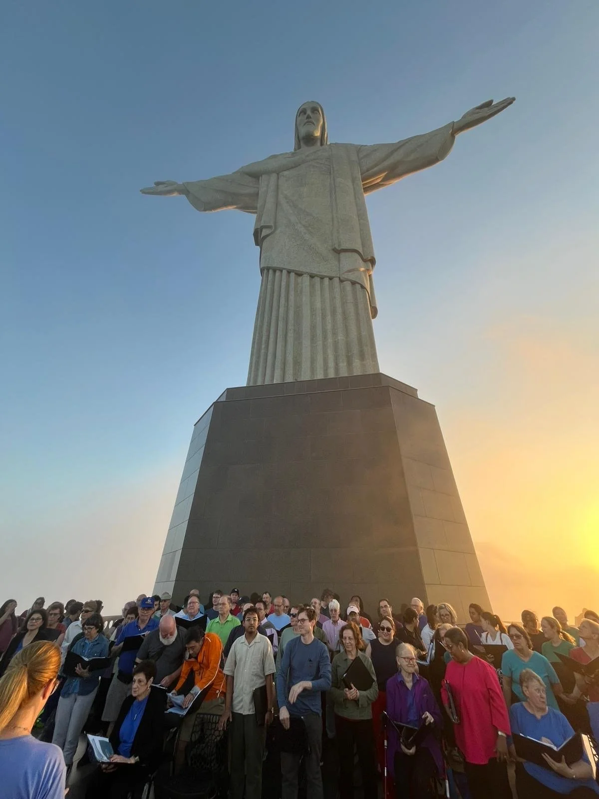 The City Choir preparing to sing at the base of the Christ the Redeemer statue in Rio de Janeiro.