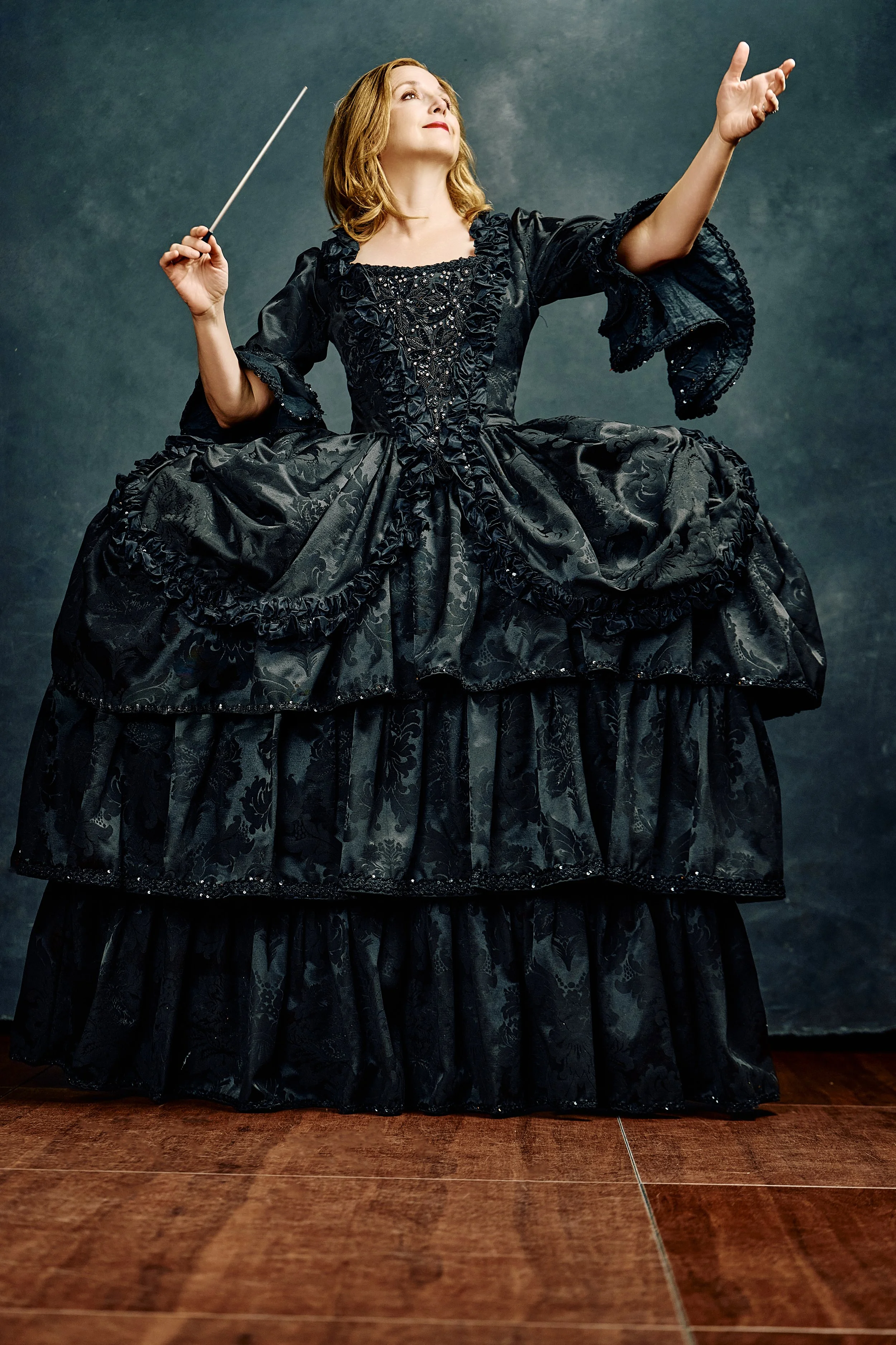 Artistic Director Erin Freeman in an extravagant 18th-century style ball gown.