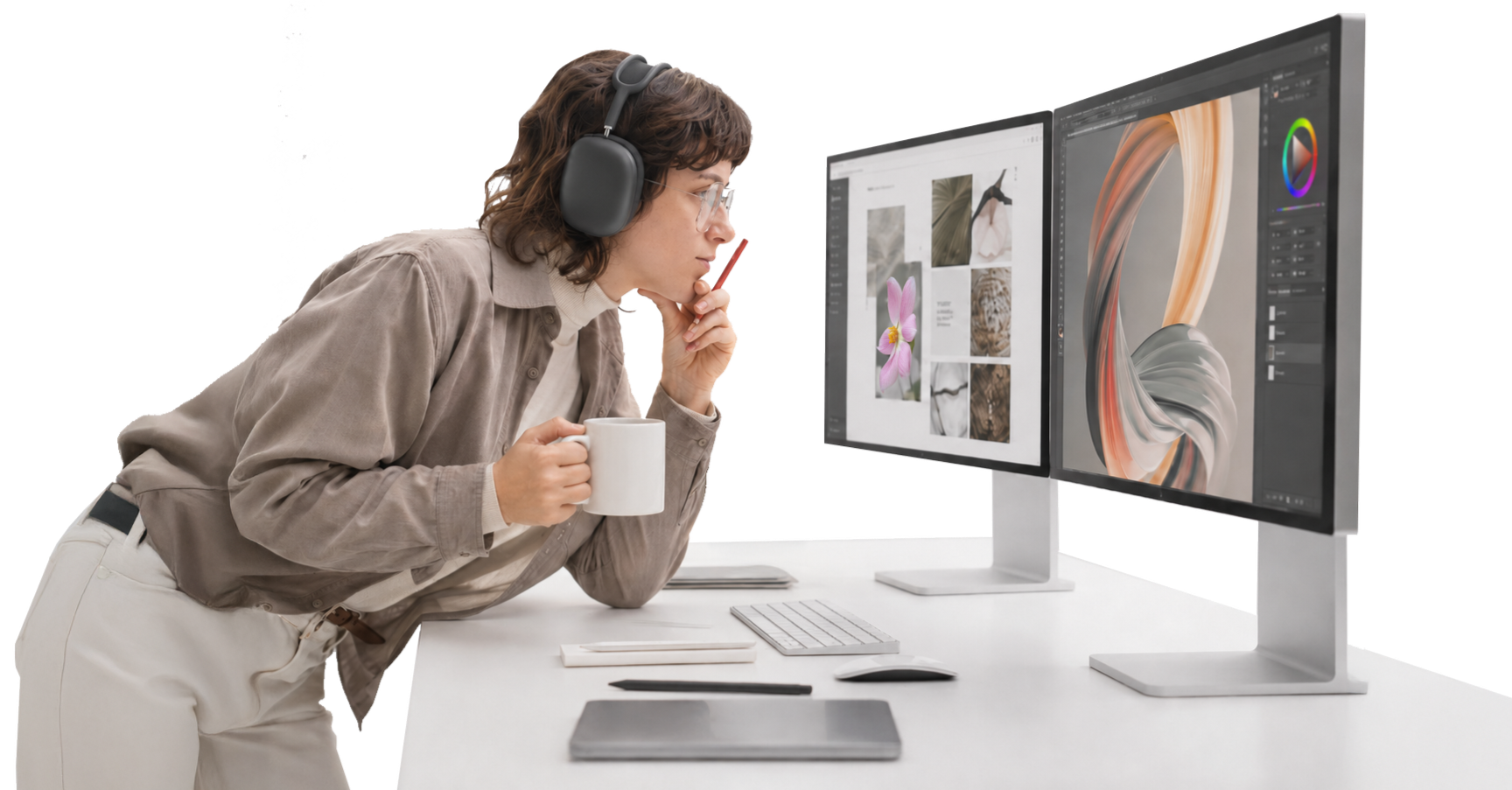 Woman wearing headphones and glasses, holding a coffee mug, looking at dual computer monitors displaying design and editing software.