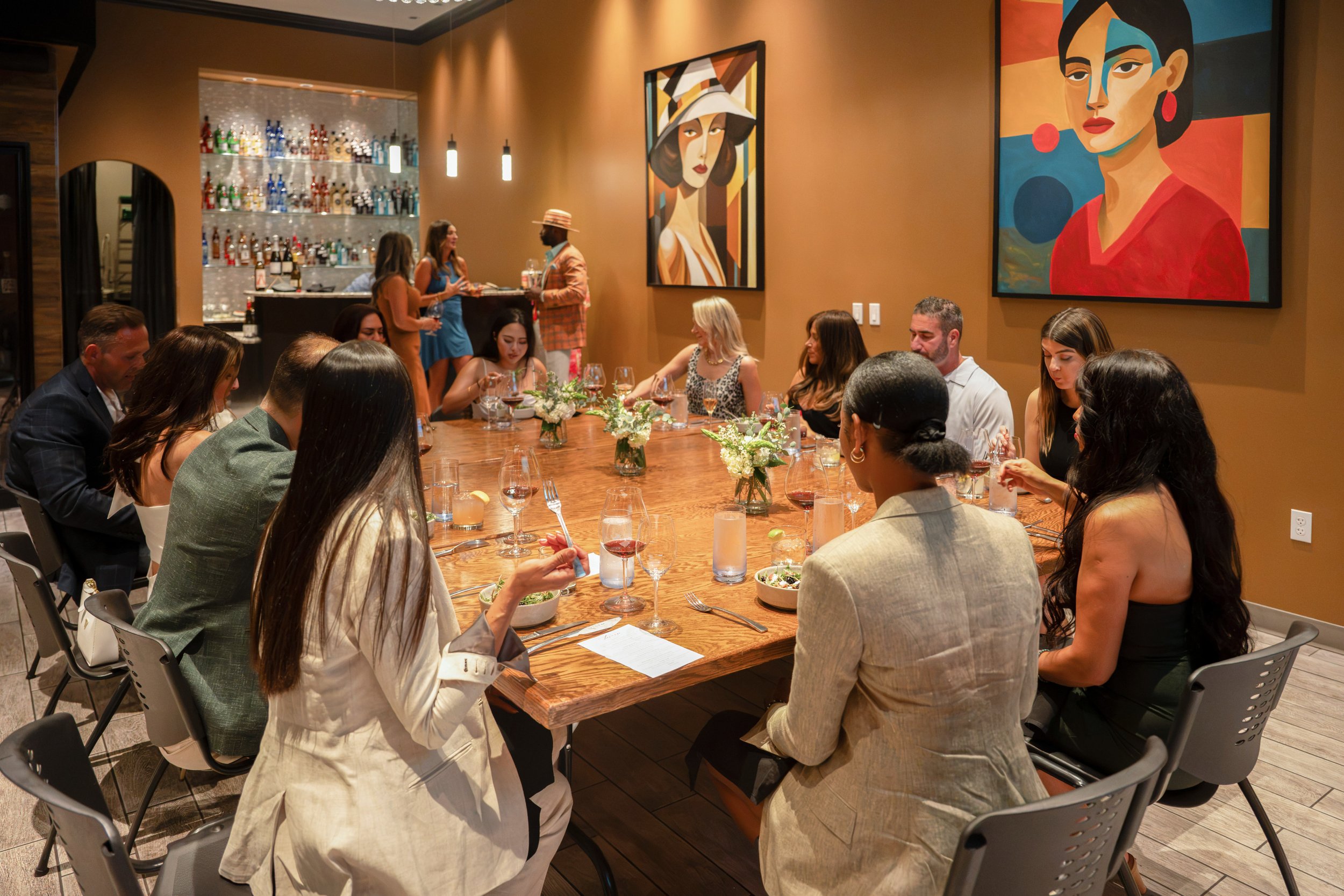 Long communal table set for twenty-four guests in the Annex 