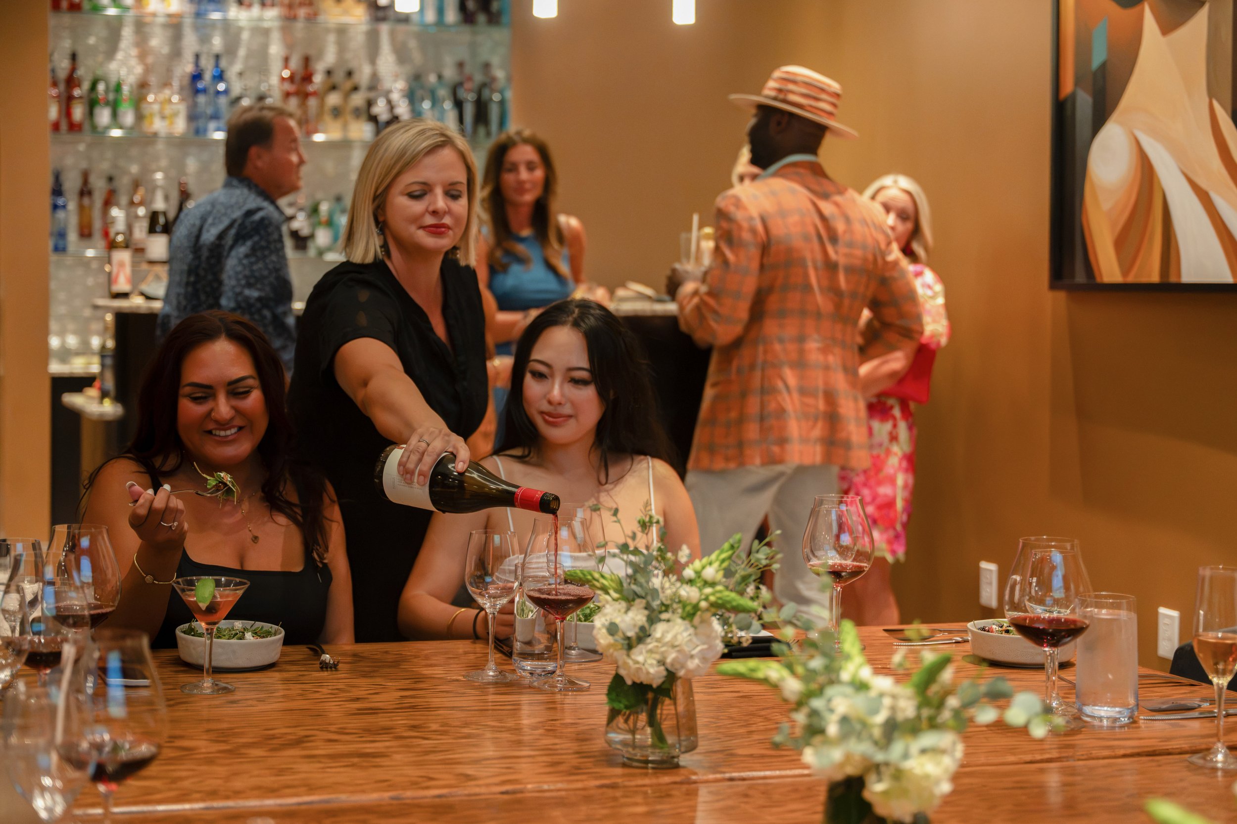 Bartender pouring wine during a private event