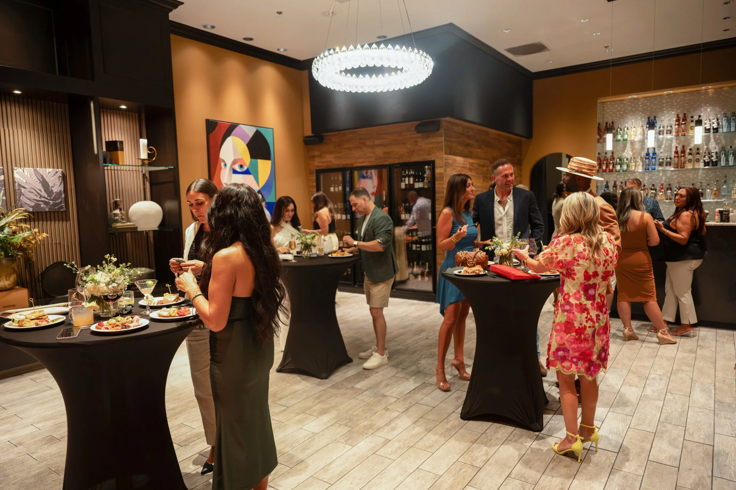 Guests mingling at a hosted cocktail reception in The Annex event space at Tavern on Kruse.