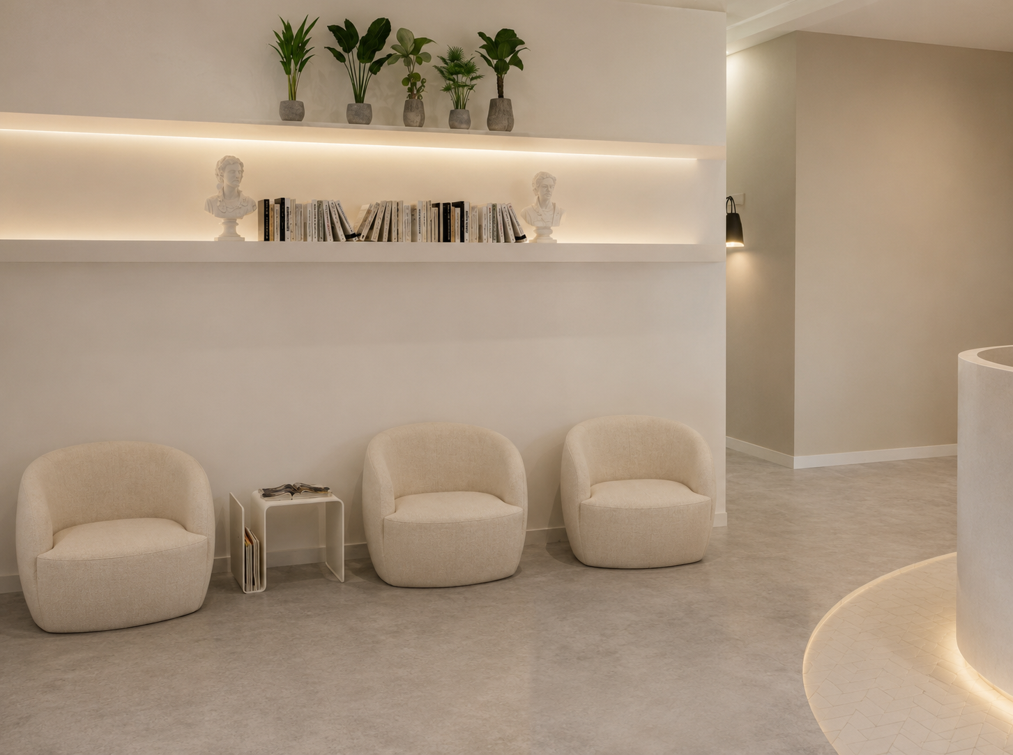 Modern commercial interior designed by Robu Design with neutral finishes, lounge seating and integrated lighting.