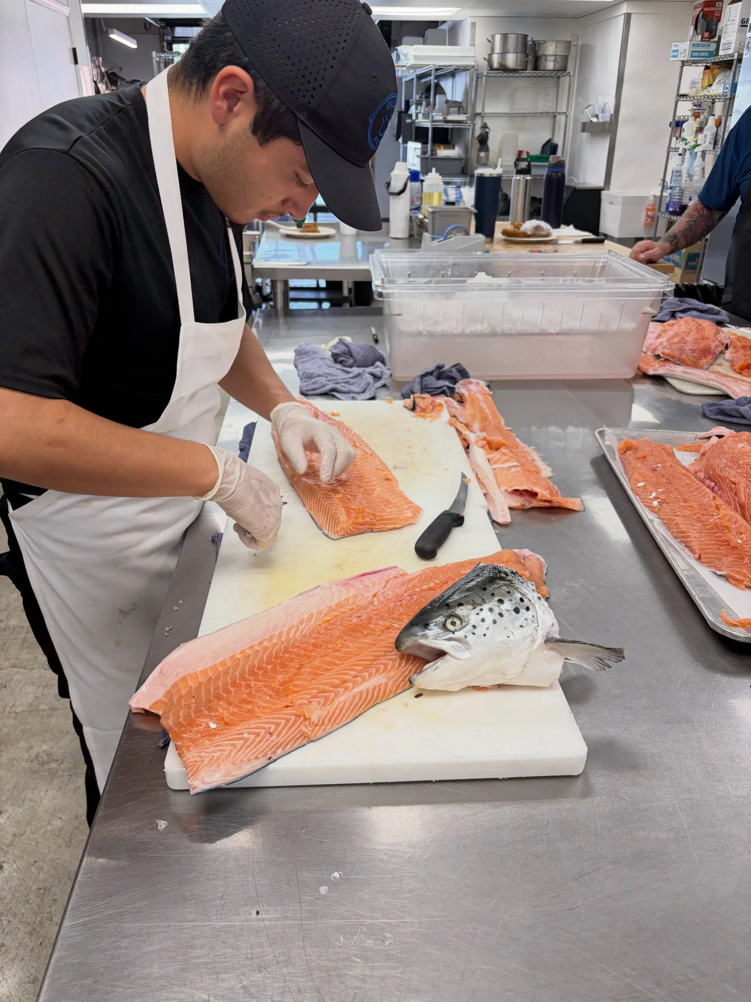 At Blue Pot we are always wanting to learn.  Our chefs are teaching apprentices from JCCC how to break down a salmon @fortunefishgourmet #cantlearnenough