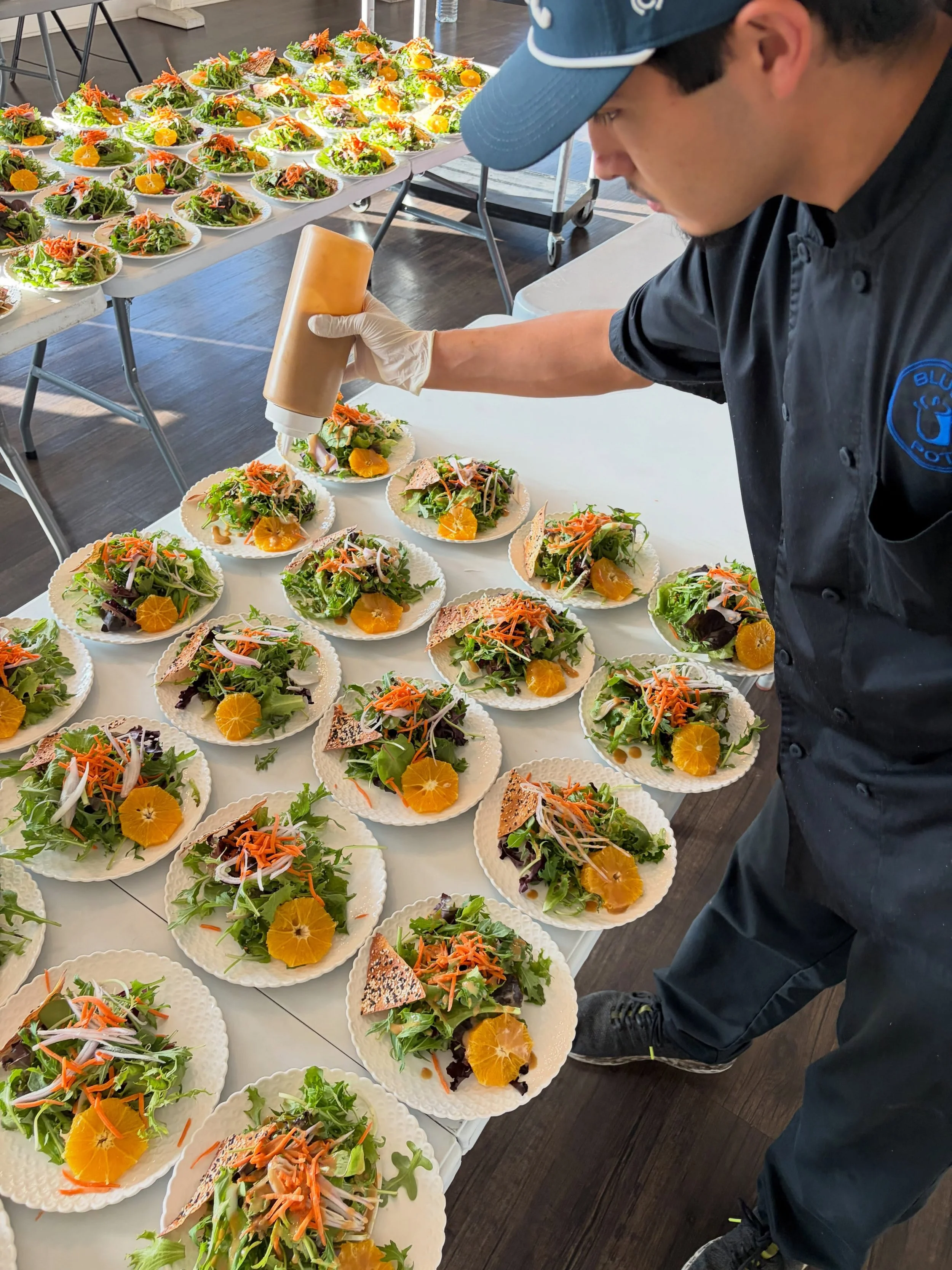 Ulises making the salads look good!
