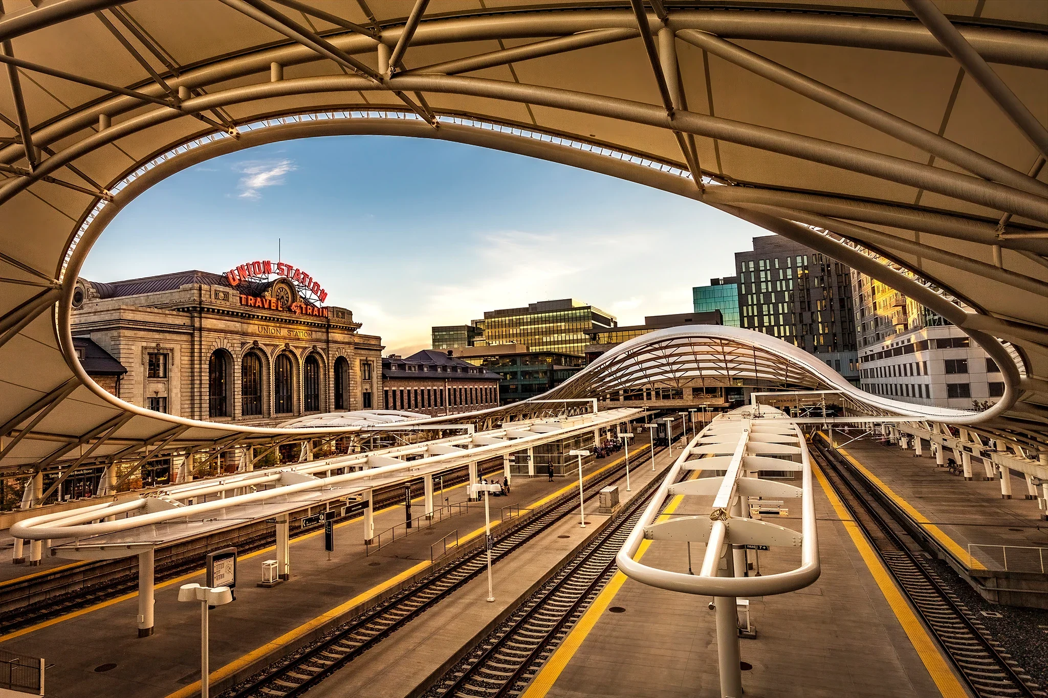 Union Station — Denver — view through decorative canopy, red neon sign, blue sky