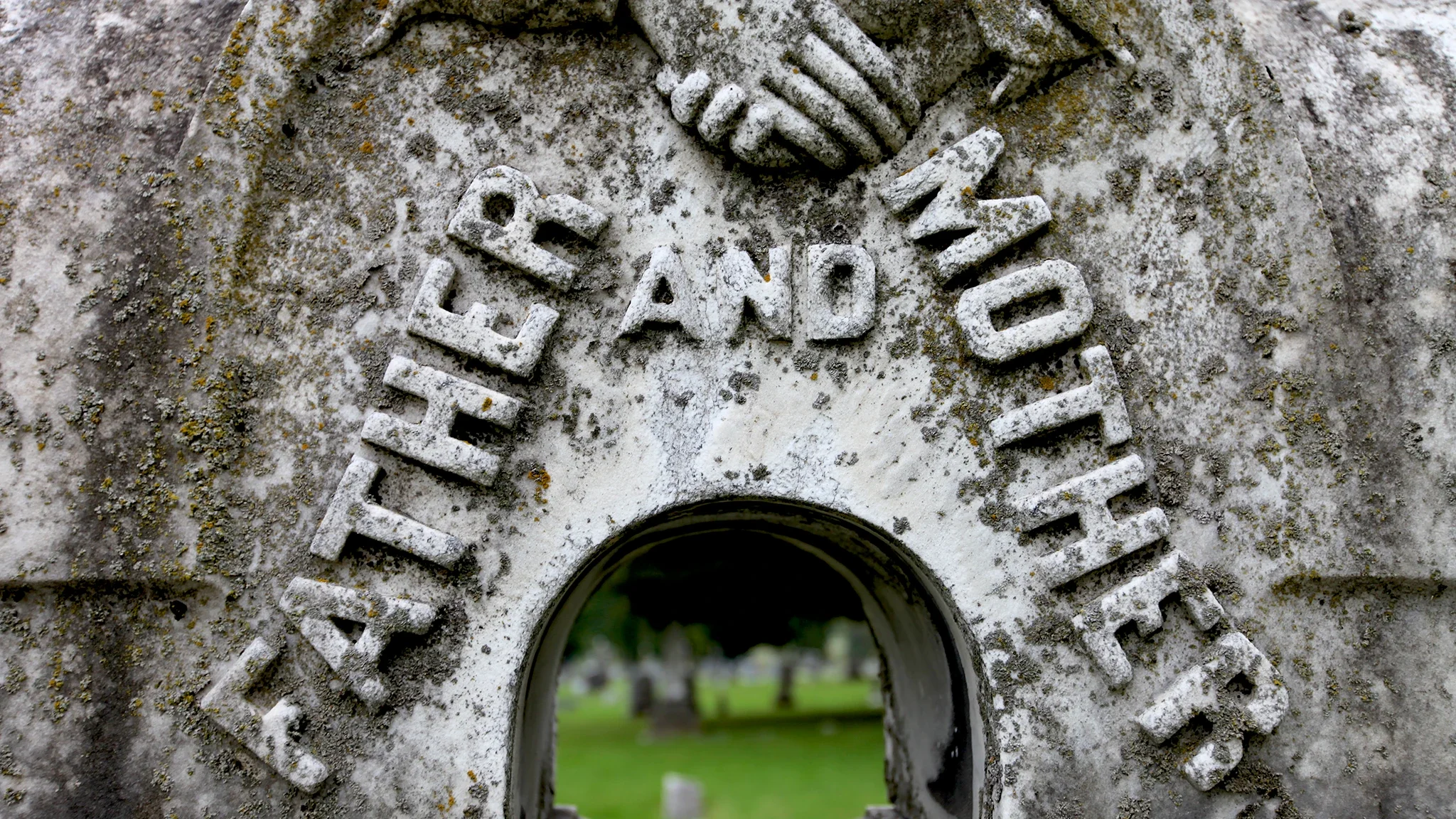 Father and mother carved into gravestone at Mt. Olivet Cemetery, Nashville — editorial