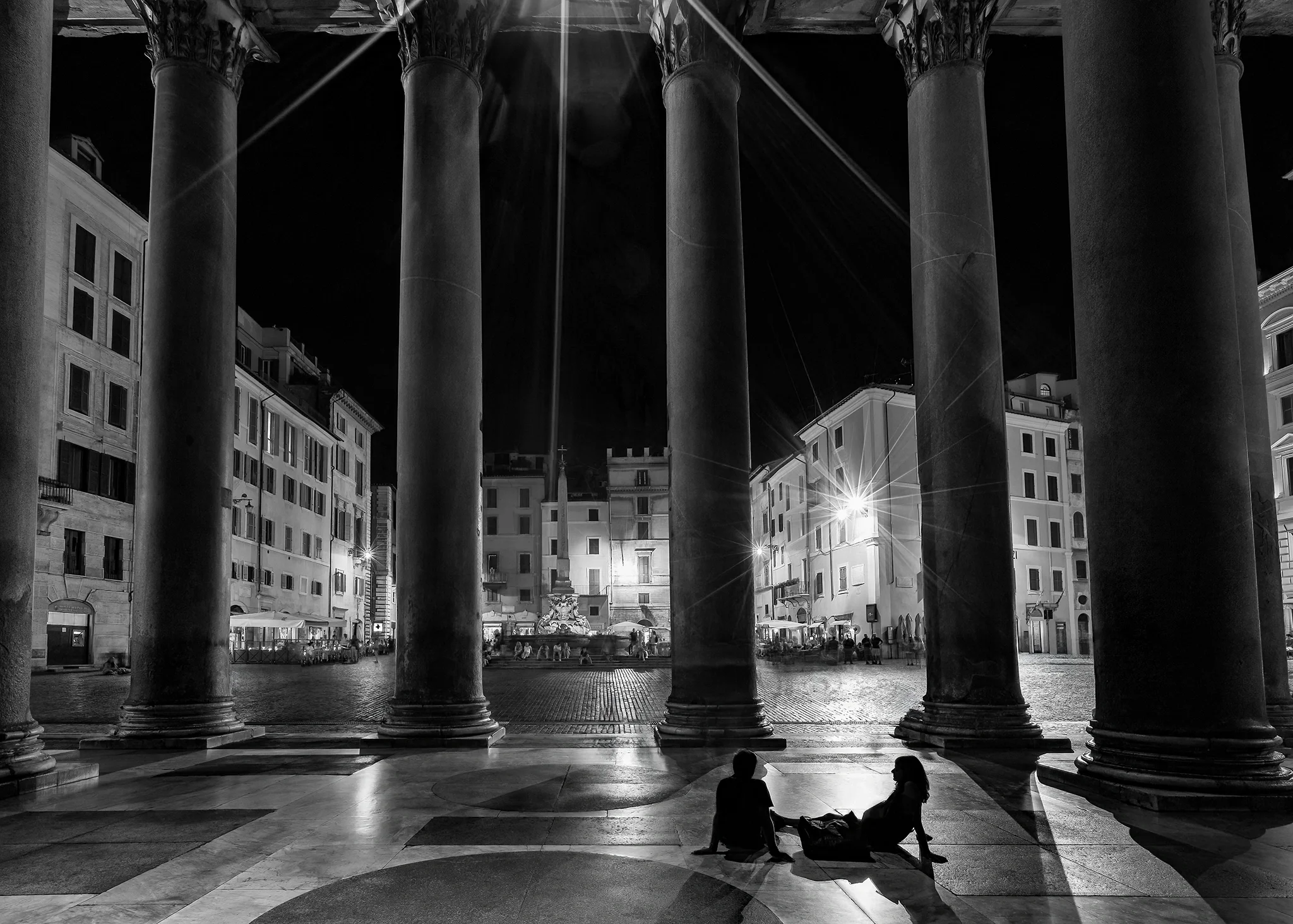 Young lovers resting inside the Pantheon portico, Rome — travel editorial