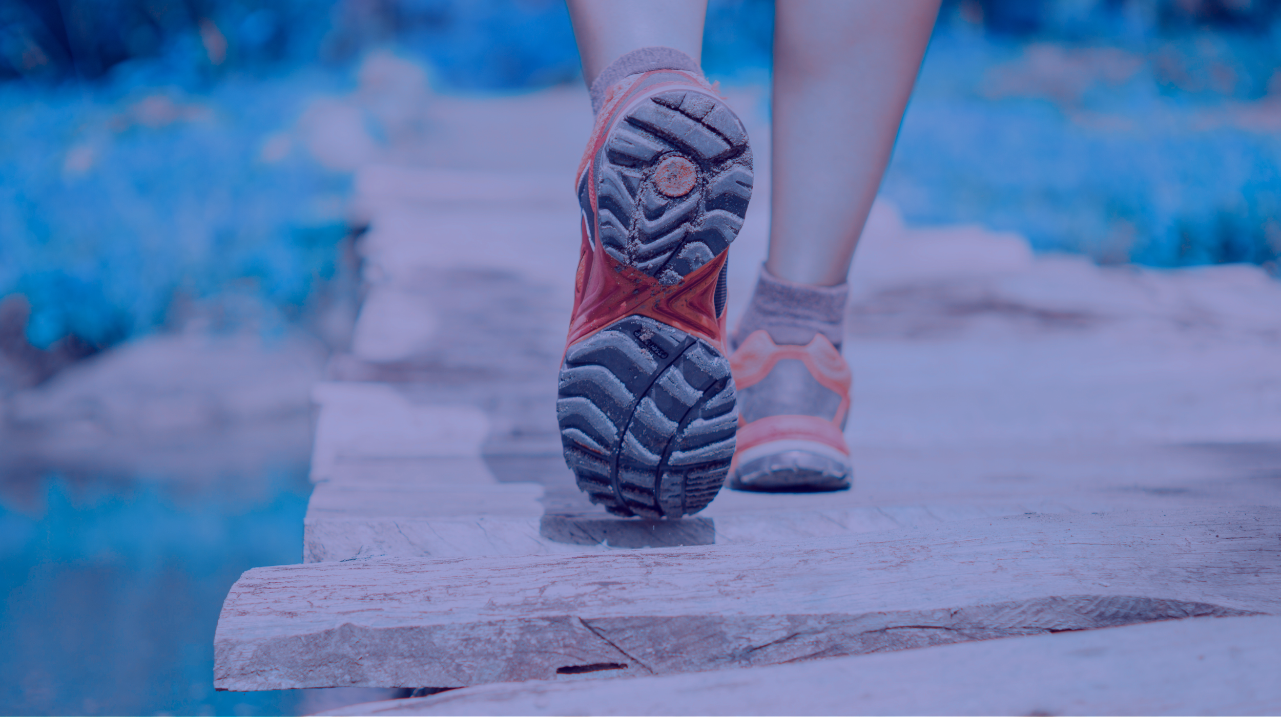 Close-up of running shoes crossing a bridge, representing the Lace Up Method and a strategic path to marketing growth.