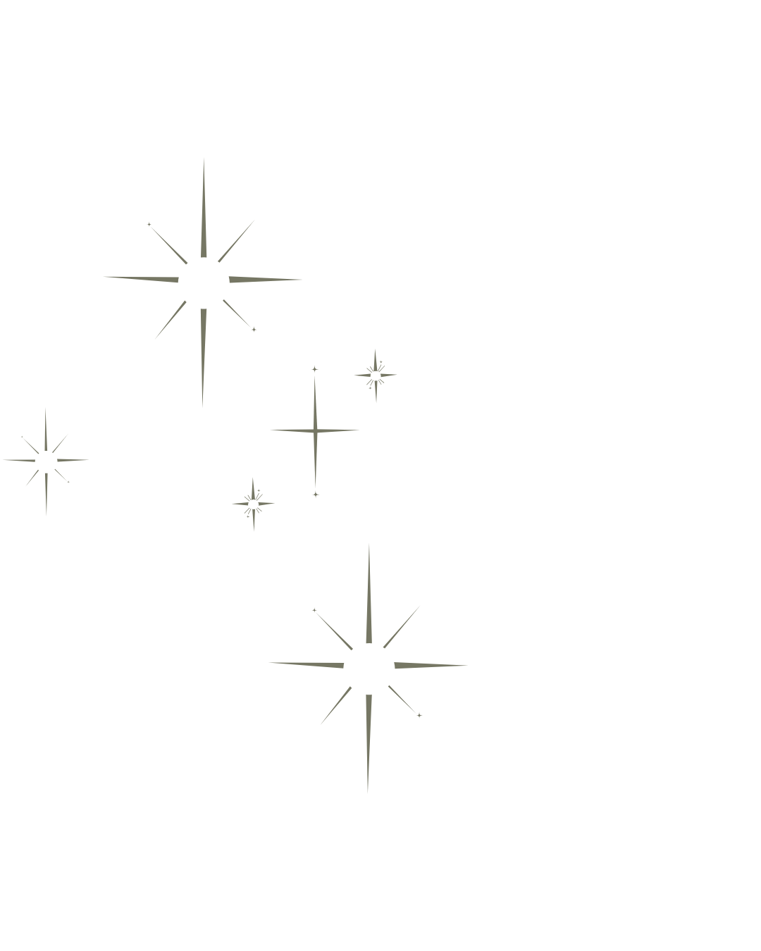 Four stylized stars with trails on a black background, varying in size and brightness.