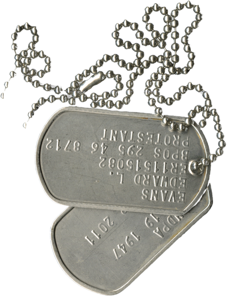 A collection of military dog tags with engraved text, attached to a ball chain, resting on a flat surface.