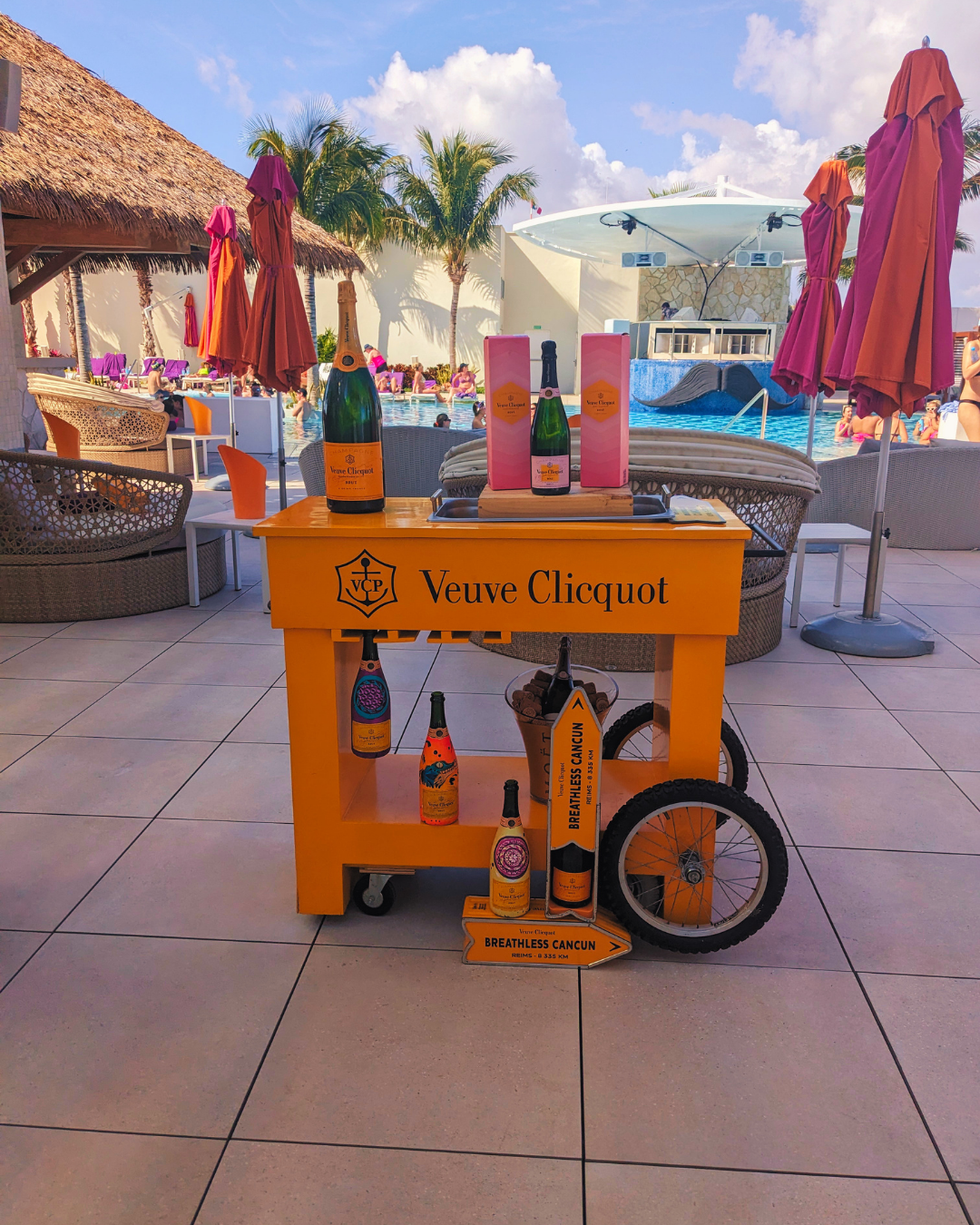 Poolside Veuve Clicquot champagne cart at a resort cabana