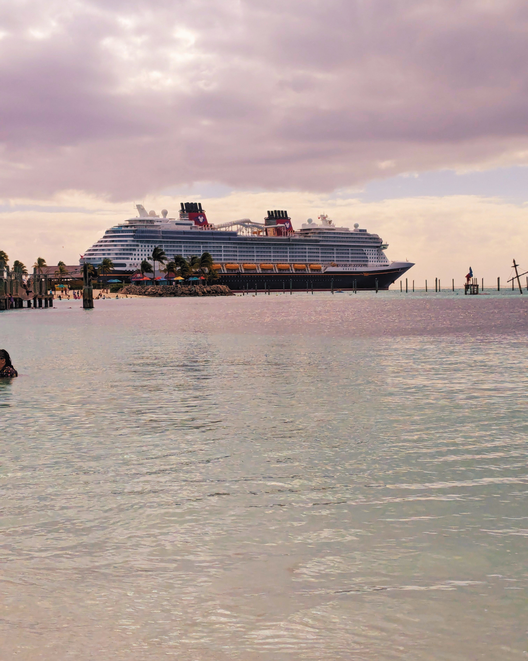 Disney Cruise Line ship docked at sunset