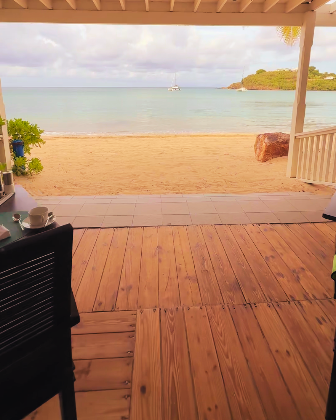 Wooden deck overlooking a sandy beach in Grenada