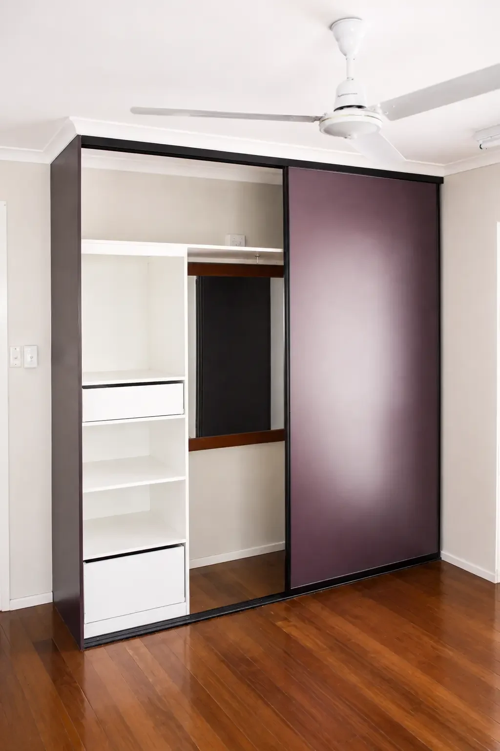 Custom timber wardrobe with shelving, drawers and hanging space