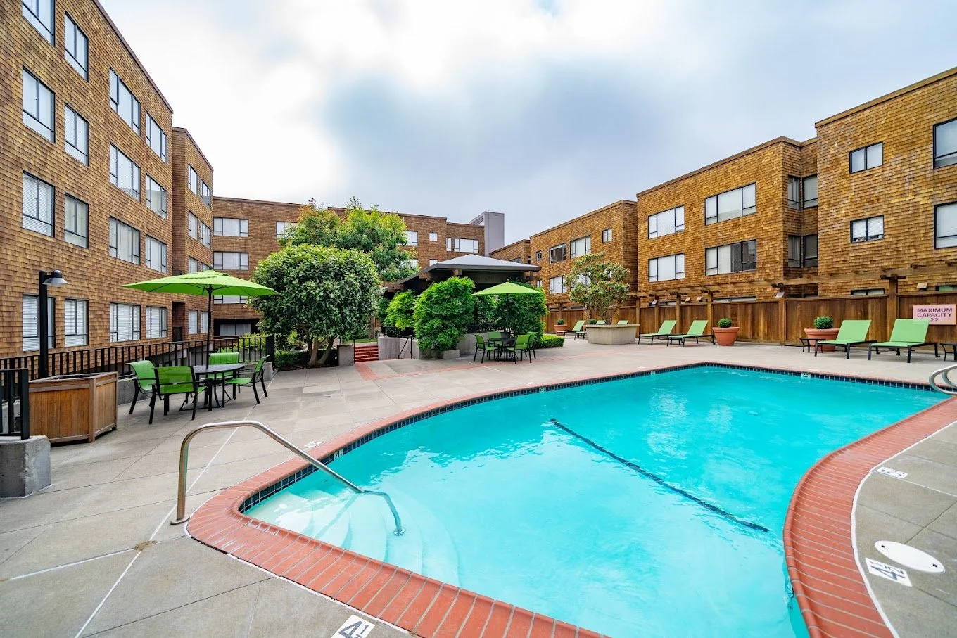 Photo of a pool with surrounding apartments or multi family units.