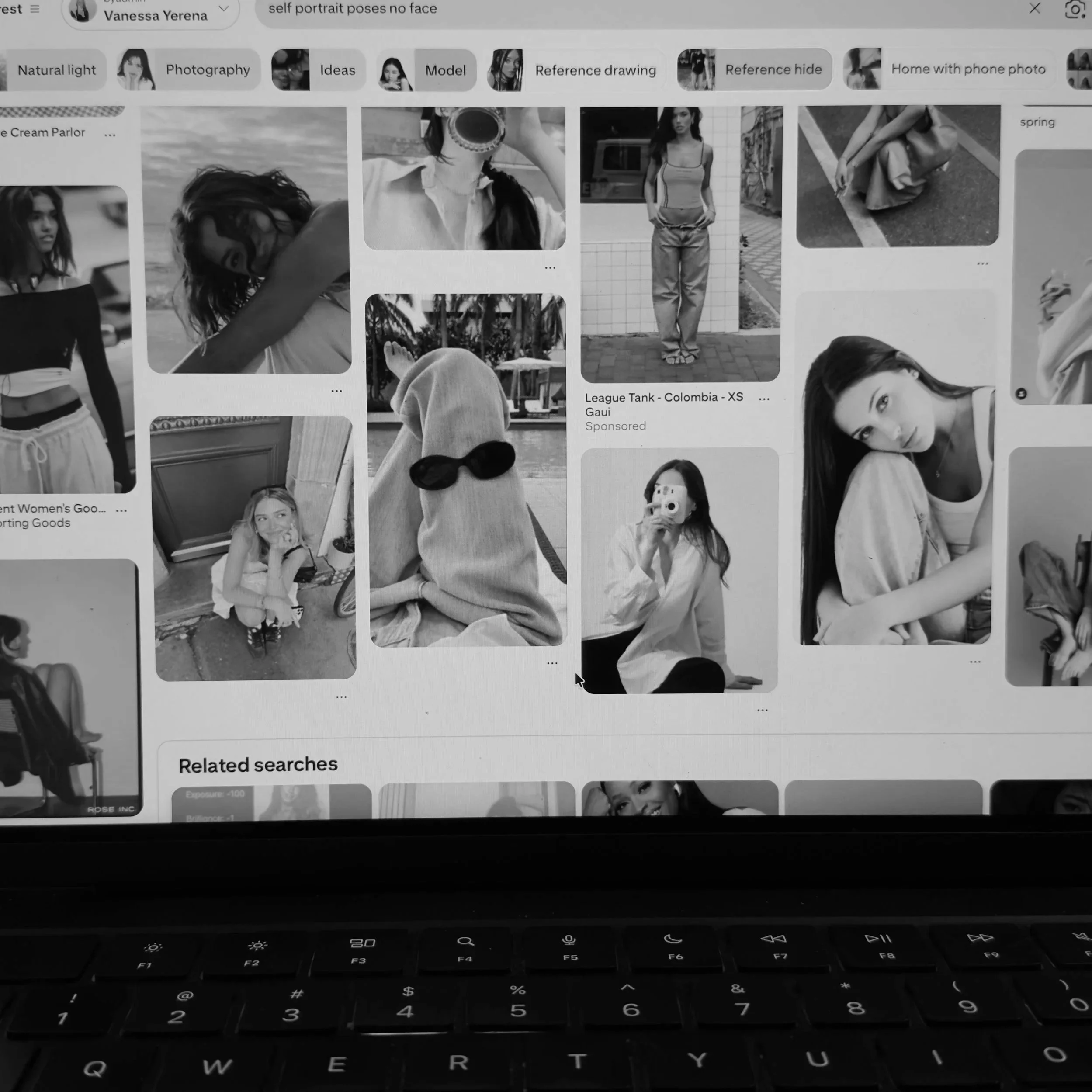 A computer screen displaying a visual search interface with black-and-white photos of women, including one holding a drink, a woman in casual attire standing outside, and a woman with long hair lying on her side. The screen shows related searches and options like 'Natural light', 'Photography', and 'Model'.