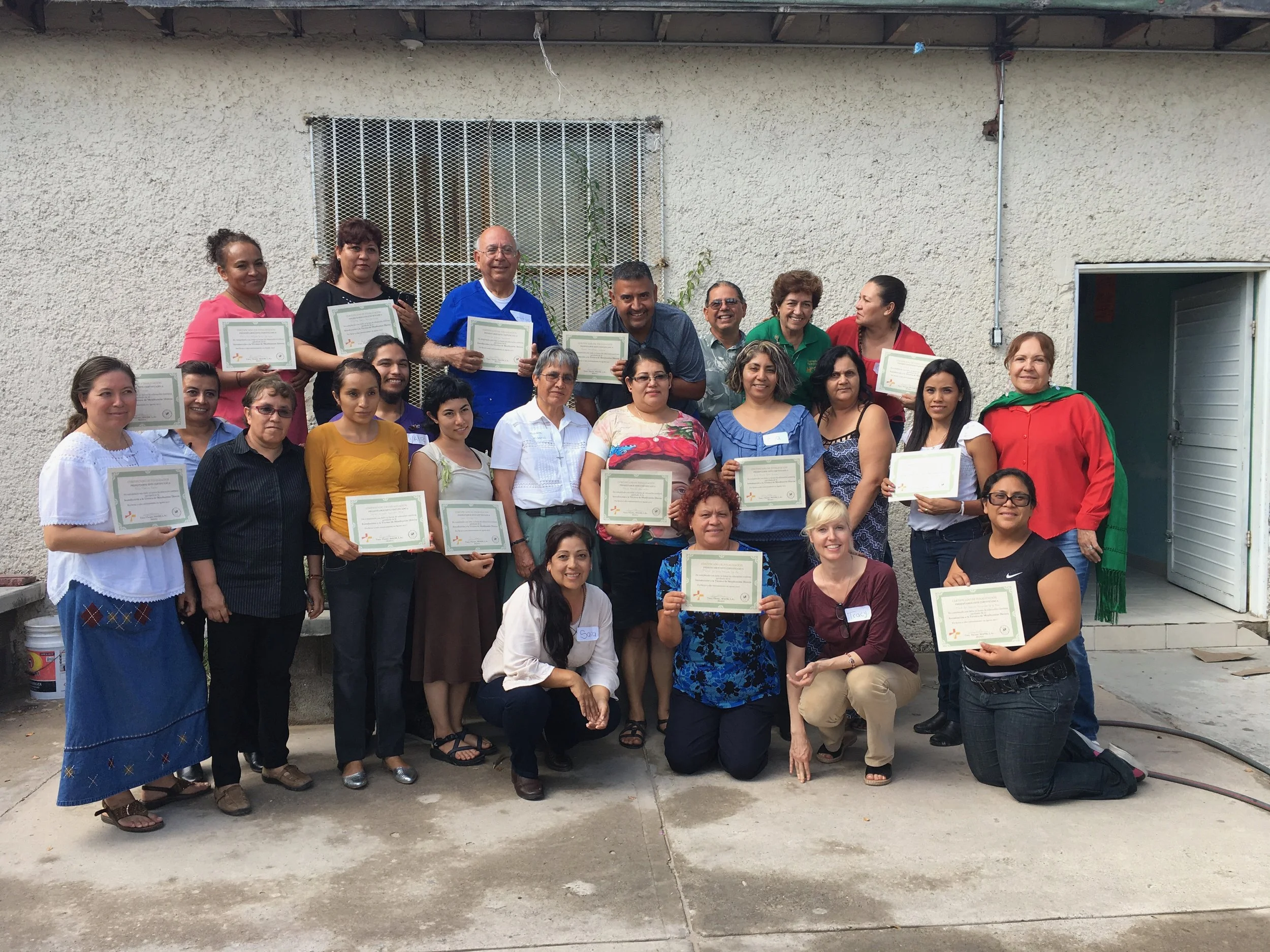 Tracy Thorne with participants in a community moxibustion training program.