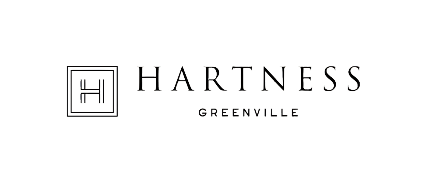 Logo for Hartness Greenville featuring a stylized H inside a square and the text 'Hartness Greenville'.