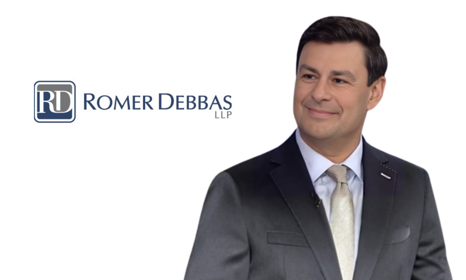 Professional man wearing a suit and tie smiling at camera, Romer Debbas LLP logo on white background.